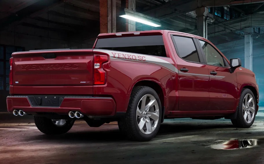 The rear view of a red-with-white-stripes 2021 SVE Yenko/SC Chevrolet Silverado