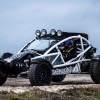 White-framed Ariel Nomad Tactical parked on a gravel road