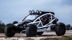 White-framed Ariel Nomad Tactical parked on a gravel road