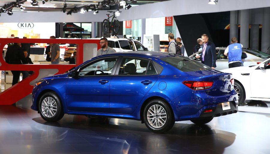 A blue Kia Rio on display at an auto show