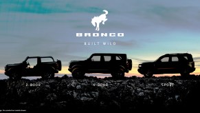 The silhouette of three SUVs against the sunrise.