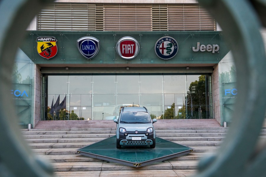 The logos of automobile companies (L-R) Abarth, Lancia, Fiat, Alfa Romeo and Jeep are pictured at the entrance to the Fiat Chrysler Automobiles (FCA)