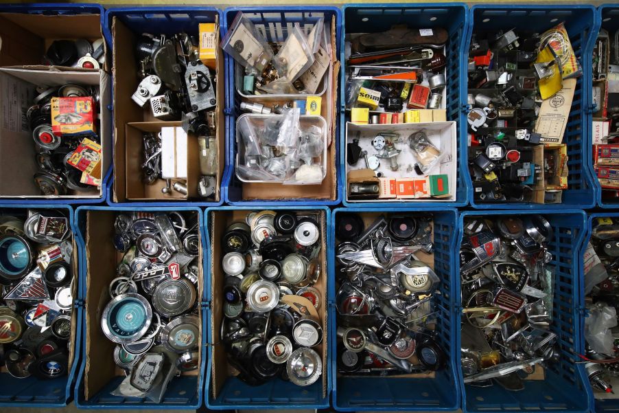 Bins of classic car parts at a classic car show