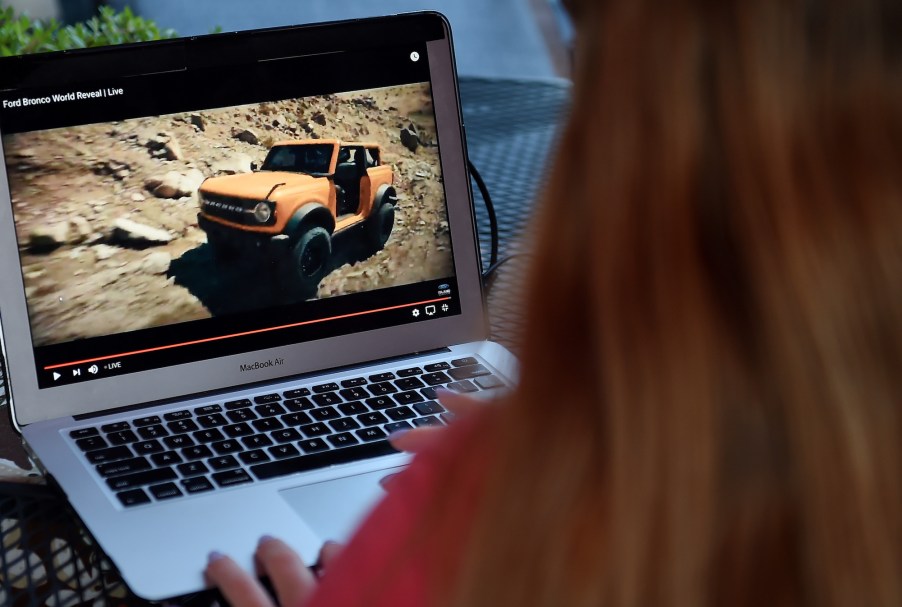 This illustration picture shows a person watching the 2021 Ford Bronco Family World Premiere on a computer in Arlington, Virginia