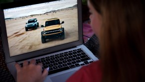 This illustration picture shows a person watching the 2021 Bronco Family World Premiere on a computer in Arlington, Virginia on July 13, 2020