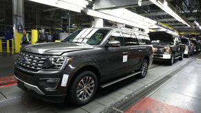 Factory workers assemble Ford Expeditions