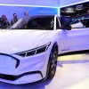 Attendees examine the Ford Mustang Mach-E all electric vehicle at the Chicago Auto Show