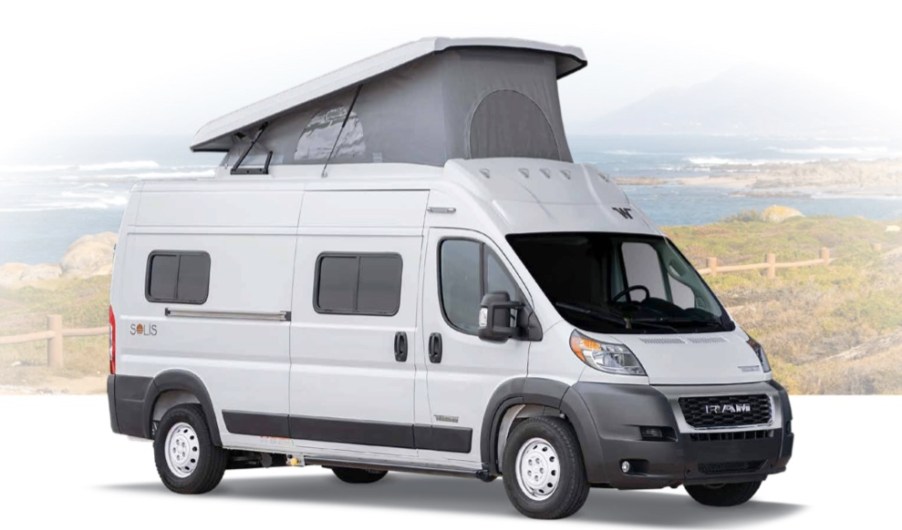 Winnebago Solis RV camper with it's roof tent popped open, parked with a Mountain View