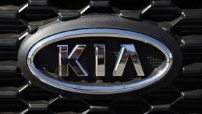 A Kia logo seen on the front grille of a car