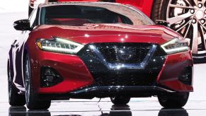 A Nissan Maxima on display at an auto show