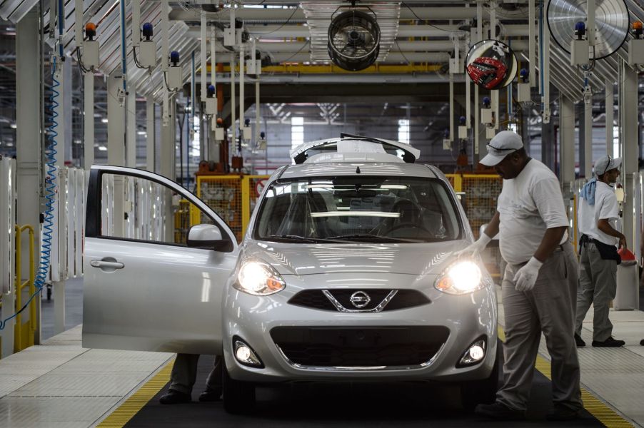 Cars get the final inspection in the assembly line of the March and Versa models at Nissan's Industrial Complex