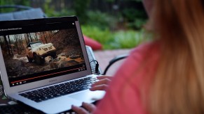 This illustration shows a person watching the 2021 Ford Bronco Family World Premiere on a computer in Arlington, Virginia