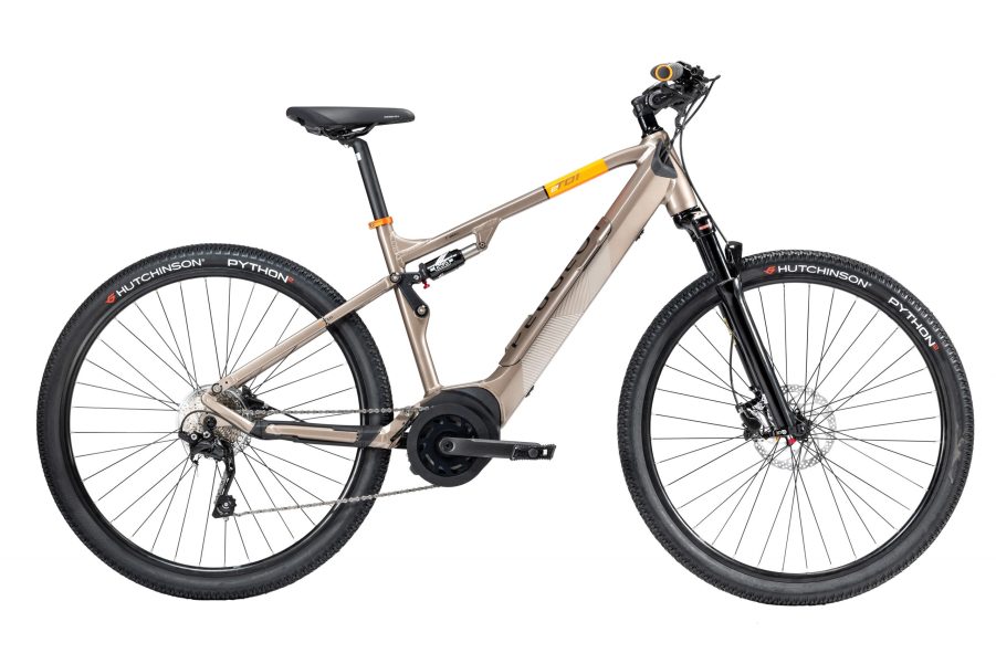 A tan-framed Peugeot eT01 Crossover FS e-bike