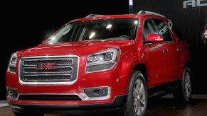 A red GMC Acadia on display