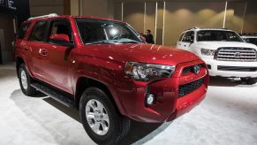 A red Toyota 4Runner on display at an auto show