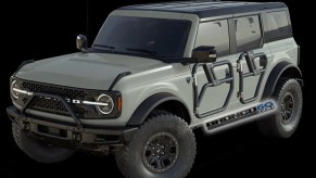 A render of a green 2021 Ford Bronco with tube doors