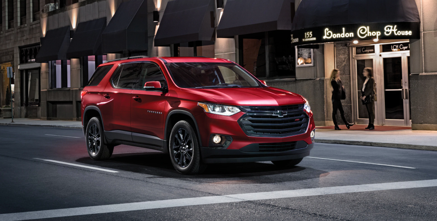 2020 Chevy Traverse driving on city street at night