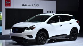 A white Nissan Murano on display at an auto show