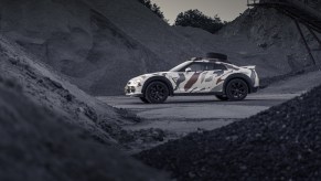 The camo-wrapped R35 Nissan GT-R modified by Classic Youngtimers Consultancy parked in a quarry