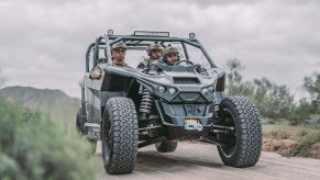 A Nikola Reckless is loaded up with soldiers and heading down a dirt road.