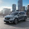 A sharp, gray 2020 Honda CR-V Touring model parked in the city.