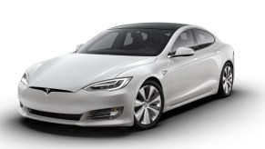 a sleek Tesla Model S press photo against a white backdrop