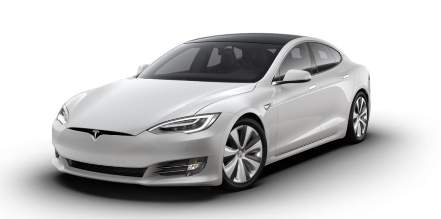 a sleek Tesla Model S press photo against a white backdrop