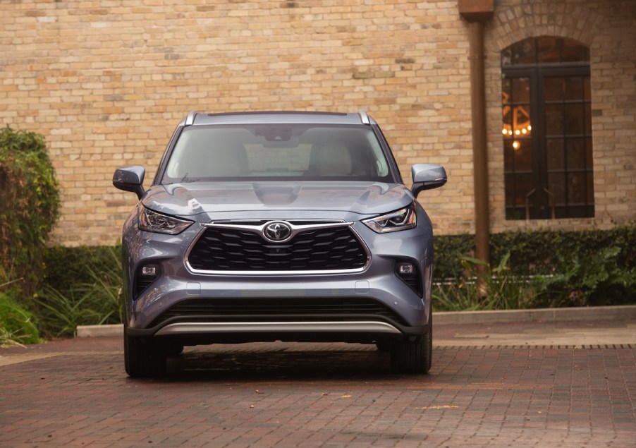 2020 Toyota Highlander parked outside of a brick building