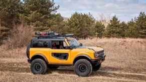 2021 Ford Bronco driving through mud and dirt