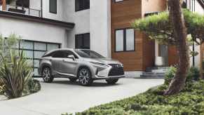 A sharp, grey 2021 Lexus RX parked on a sleek driveway.