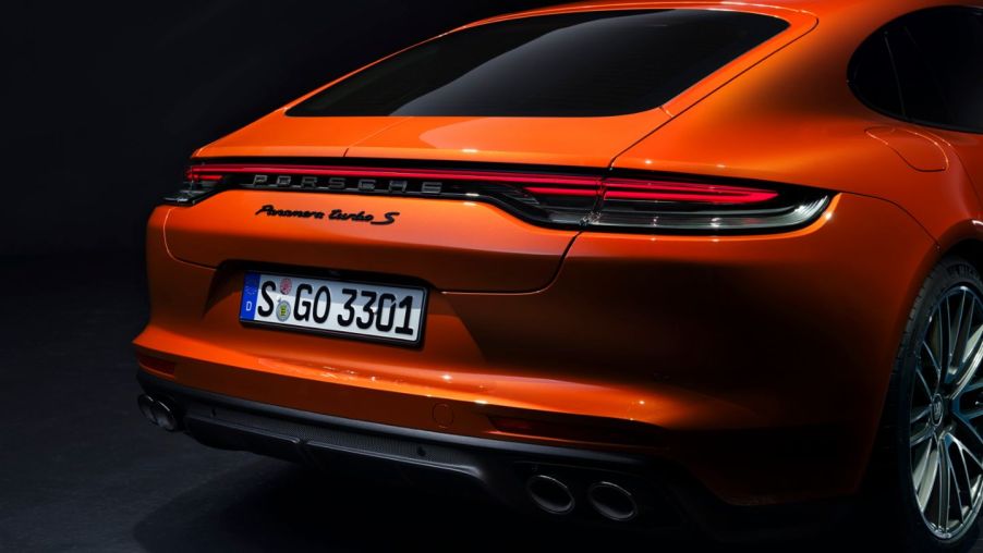 A rear-view of a bright orange 2021 Panamera.