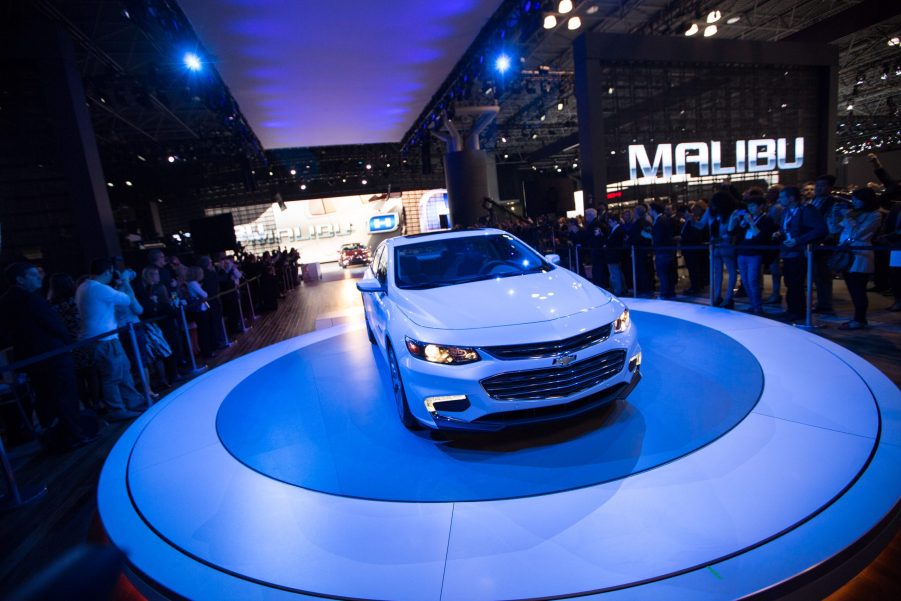 A Chevy Malibu being debuted at an auto show