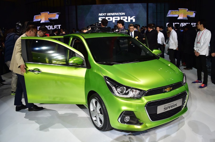 Visitors look at Chevrolet's next generation Spark car during a press preview of the Seoul Motor Show