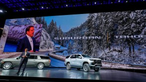 Mark Reuss, President of General Motors, talks about the new 2021 Chevrolet Suburban (left) and 2021 Chevrolet Tahoe (right) SUVs at their reveal at Little Caesars Arena