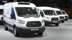 Ford Transit vans on display at an auto show