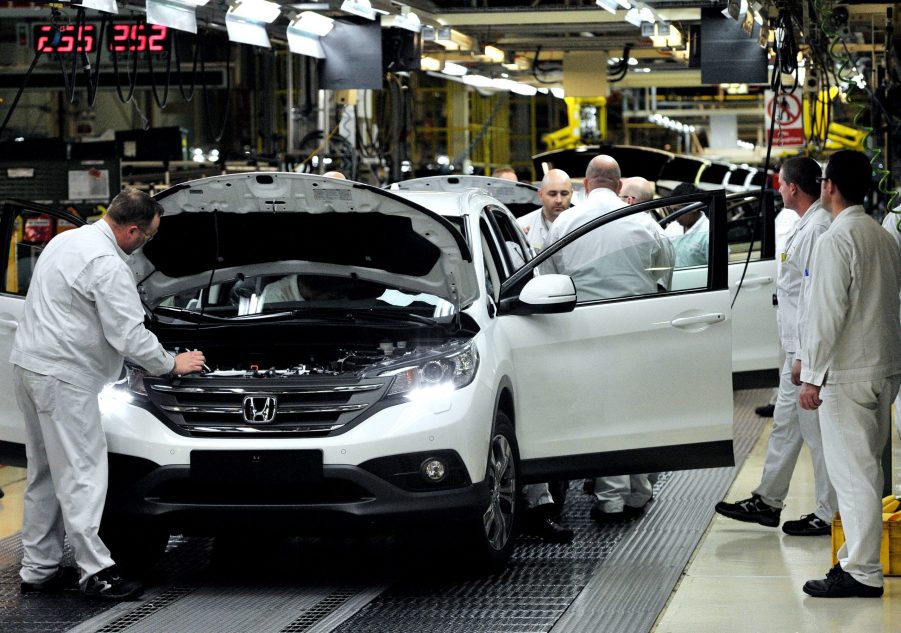 A Honda SUV being assembled in a factory