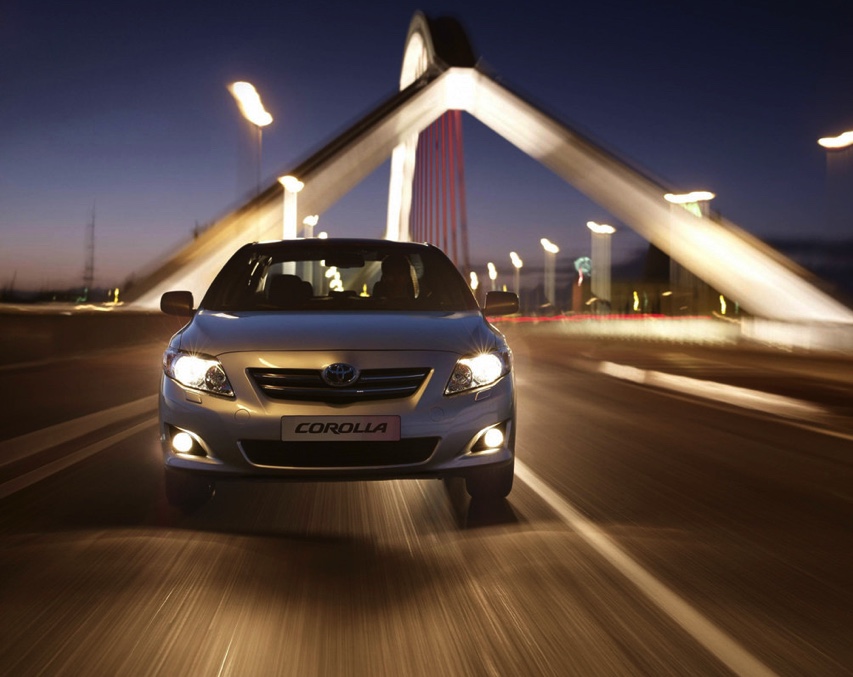 2007 Toyota Corolla driving at night in the city  