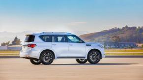 A white Infiniti QX80 on the track.