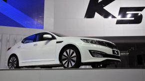 A Kia K5 on display at an auto show