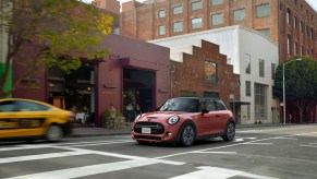 Mini Cooper driving over a crosswalk