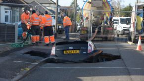 A Toyota car sits in a sinkhole which appeared overnight in Hatch Road, Brentwood, in the aftermath of Storm Ciara, which hit the country on Sunday. PA Photo. Picture date: Monday February 10, 2020. See PA story WEATHER Storm. Photo credit should read: Nick Ansell/PA Wire (Photo by Nick Ansell/PA Images via Getty Images)