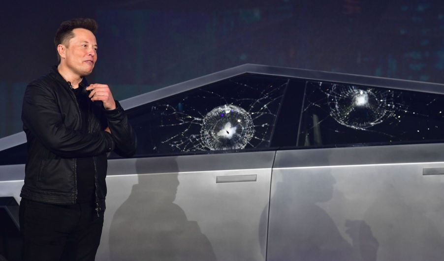 Tesla co-founder and CEO Elon Musk verbally reacts in front of the newly unveiled all-electric battery-powered Tesla Cybertruck with broken glass on windows following a demonstration that did not go as planned