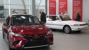 Visitors to the Toyota Motor Manufacturing plant look over the 2019 Toyota Camry, competing with the Honda Accord, at the Georgetown plant as they wait for the unveiling of the new 2019 Toyota RAV4 Hybrid