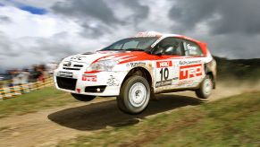 Melbourne, AUSTRALIA: Driver Simon Evans powers his Toyota Corolla over a jump as he heads towards vivtory in the Australian Rally Championship title race during the Rally of Melbourne, some 70 kilometres northeast of Melbourne, 24 September 2006. Evans only has to finish in the top five in the heat to take the title and was in second place late in the day's action. AFP PHOTO/William WEST (Photo credit should read WILLIAM WEST/AFP via Getty Images)