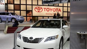 A white Toyota Corolla on display at an auto show