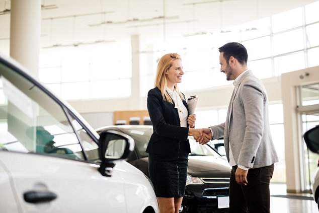 man shaking hand with woman customer