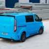 a bright blue Ford Transit connect cargo van working as an urban work truck