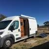 side view of the wooden doors leading inside the lovely wooden camper conversion of a fiat ducato maxi van