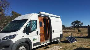 side view of the wooden doors leading inside the lovely wooden camper conversion of a fiat ducato maxi van