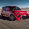 A red 2020 Kia Soul going around a corner